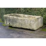 A large carved limestone trough