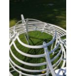 A wrought iron strapwork tree seat