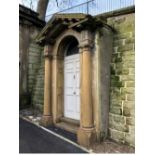 An historic Georgian carved sandstone door surround and painted pine door