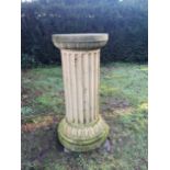 † A substantial carved sandstone column pedestal