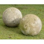 A pair of large composition stone balls