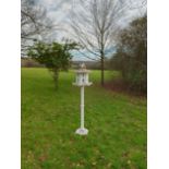 An aluminium bird table