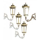 A pair of impressive brass/bronze wall lanterns with cast iron brackets