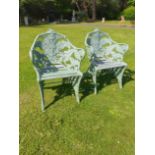 A pair of Coalbrookdale Fern and Blackberry pattern cast iron chairs