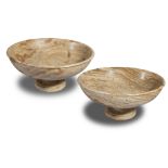 A pair of shallow marble bowls