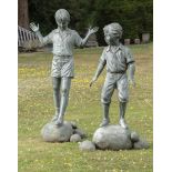 Two bronzes of children on stepping stones