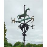 A wrought iron and copper weathervane