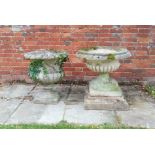 Two composition stone urns