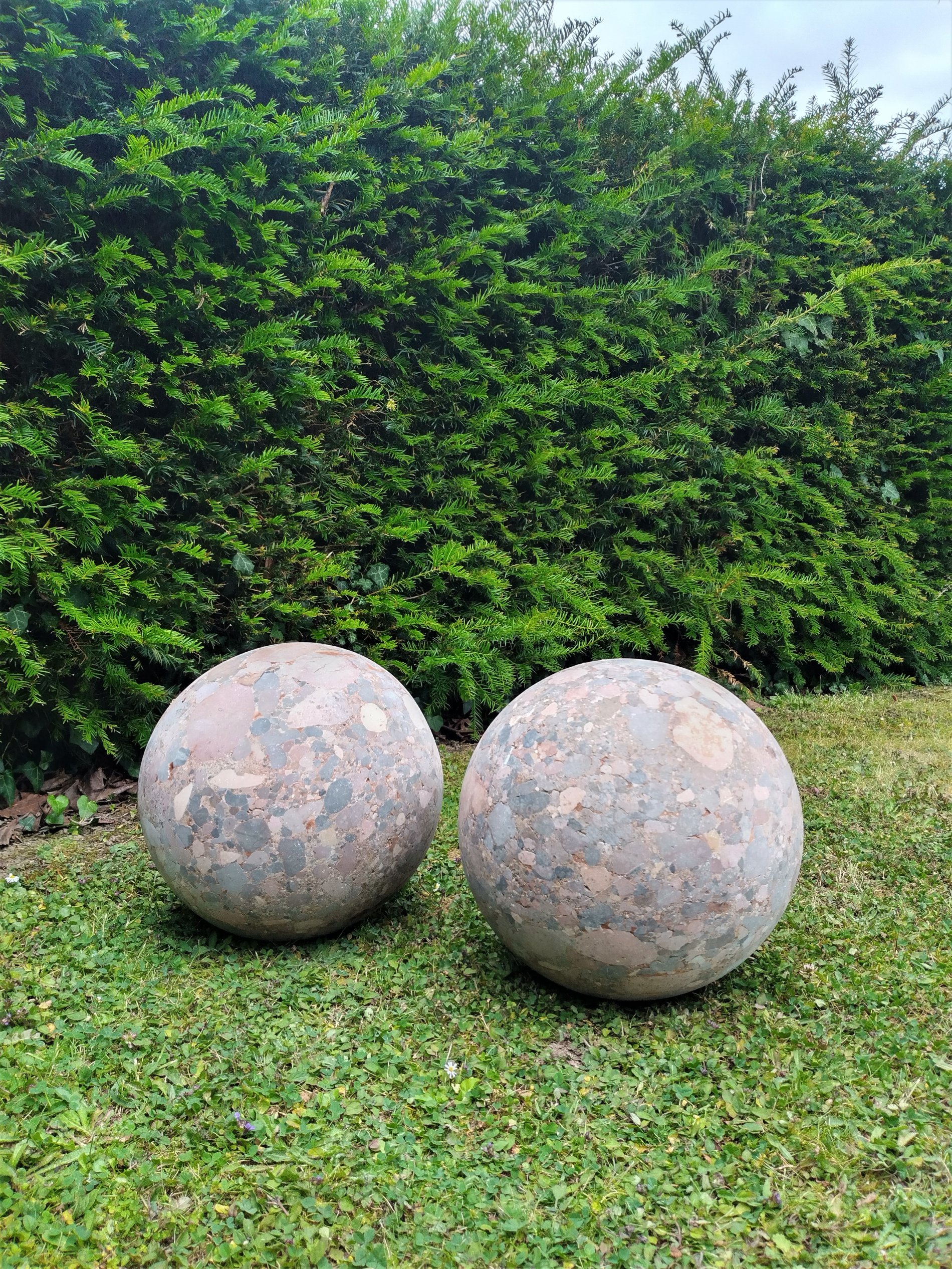 A pair of Breche marble balls