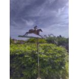 A wrought iron weathervane