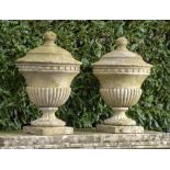 A pair of composition stone finials