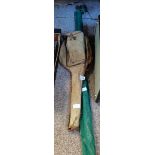 Old wooden tennis racket and fishing rod
