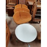Set of 3 orange Moroso retro chairs plus round white table