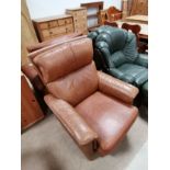 Tan leather recliner armchair