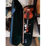 Violin in case (strings on bow need attention)