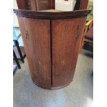 Georgian oak and mahogany bow fronted corner cupboard