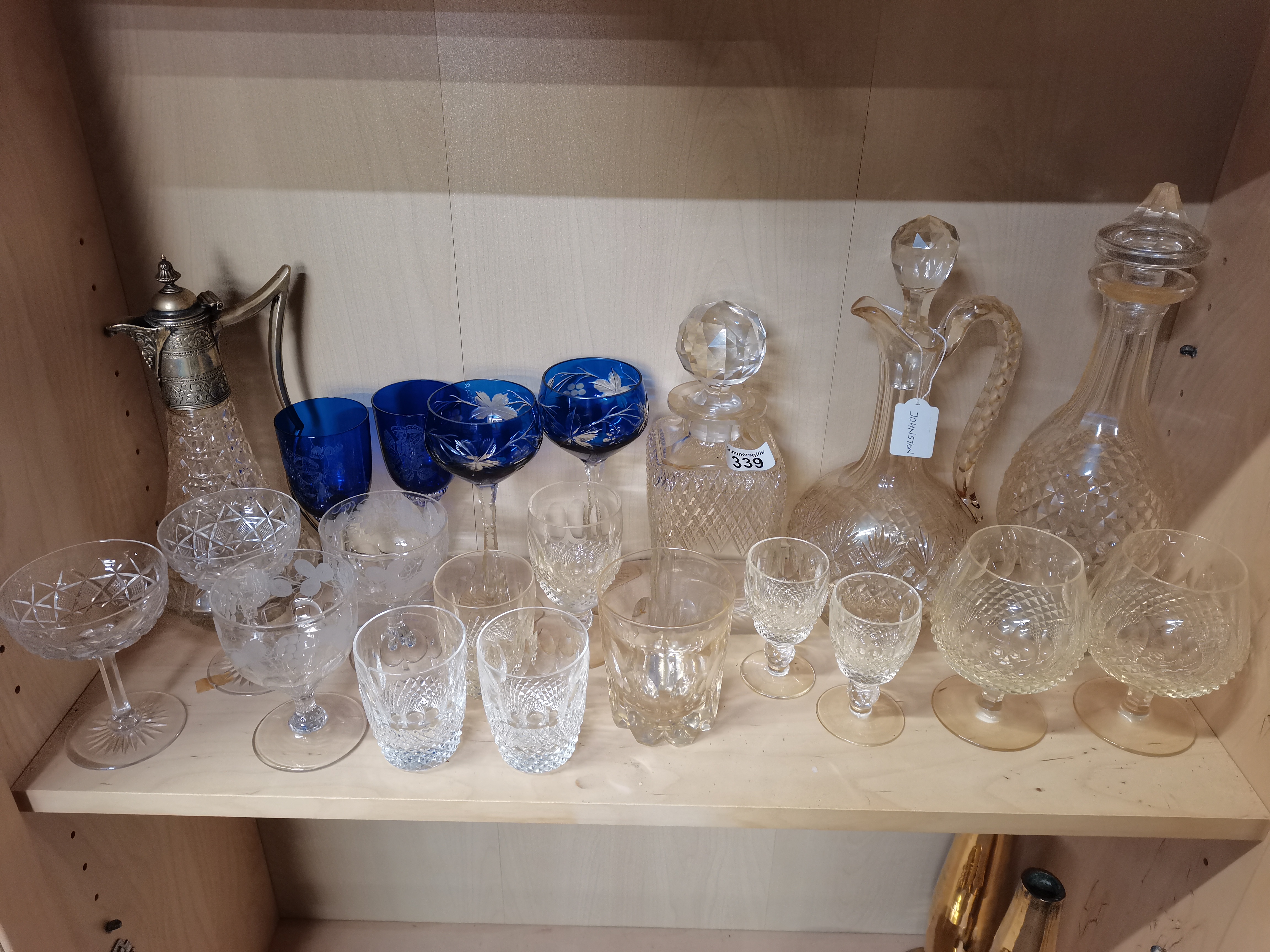 21 pieces of Glassware to include two Claret Jugs, 2 Decanters and 17 glasses