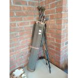 Vintage golf clubs and 2 walking sticks