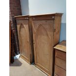 A pair of pine cupboards