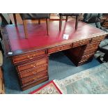Red leather partners writing desk
