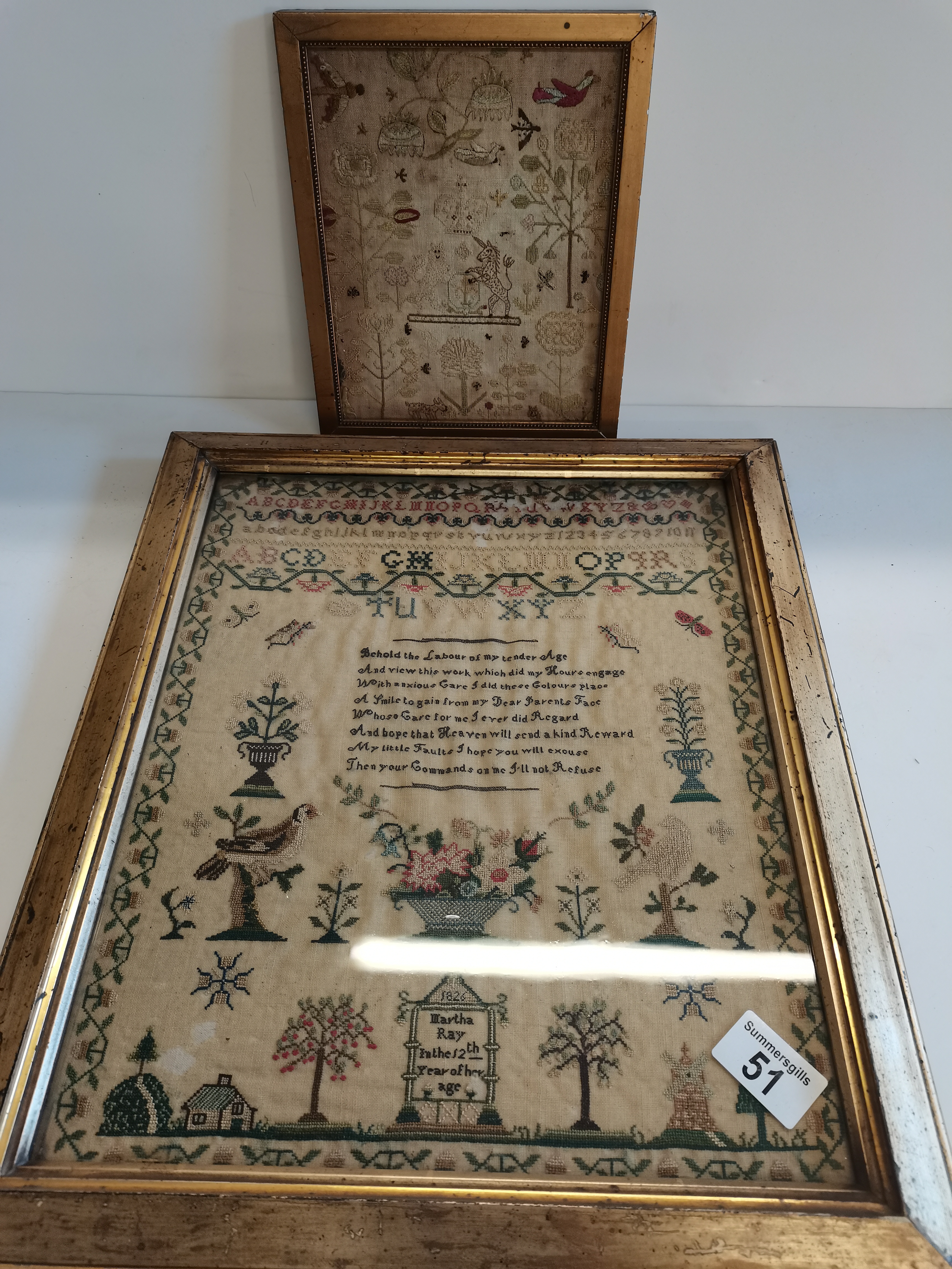 2 x samplers embroidered and dated in gold frames 1 large 1 small