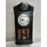 Black Wall Clock With Oriental Writing on the Glass