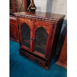 Polished wood TV cabinet with cast iron features