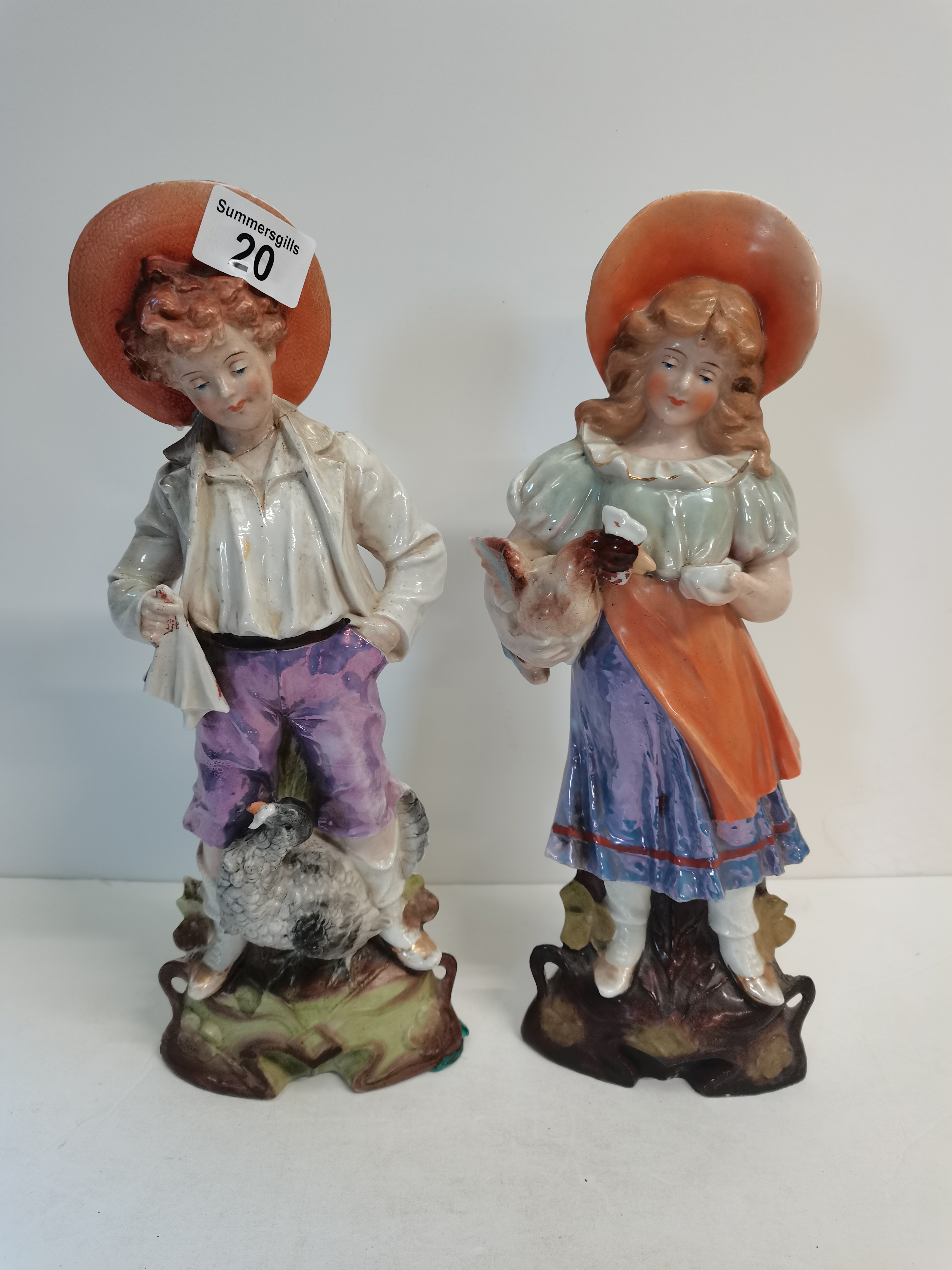 Victorian figures of boy and girl