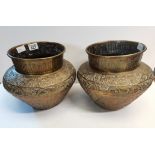 A large pair of Indian brass pots