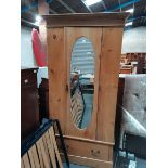 Pine wardrobe with oval mirror on door