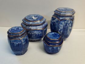A Ringtons 4 jar set 2 larger jars with lids marked "Millennium 2000" and 2 smaller caddy types