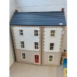 Traditional doll's house with dolls, furniture etc