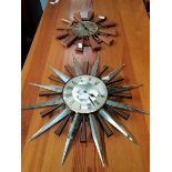 Vintage 1970s teak sunburst style decorative wall clock and a retro starburst clock