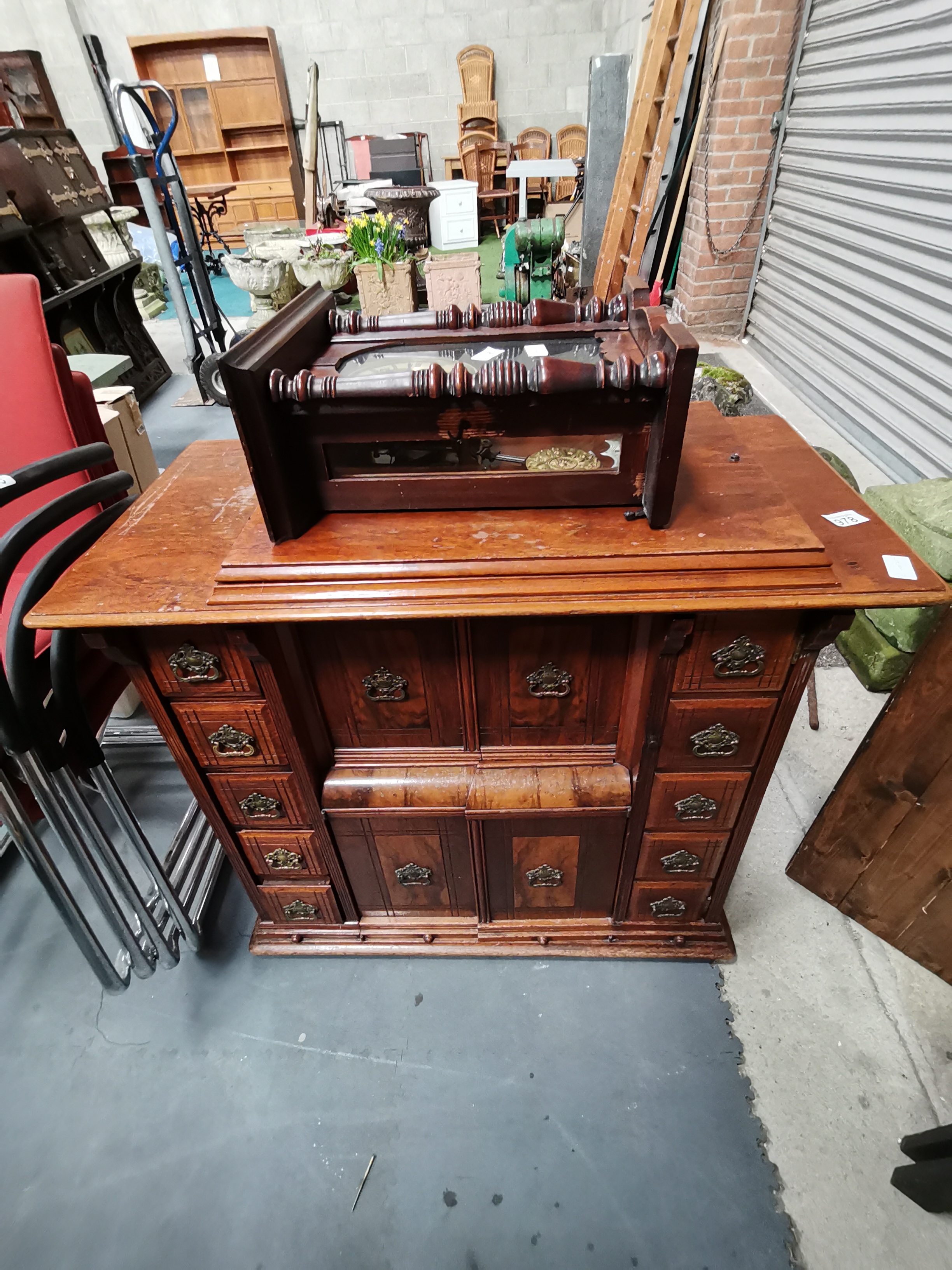 Singer sewing machine in decorative mahogany case and wall clock