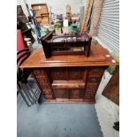 Singer sewing machine in decorative mahogany case and wall clock