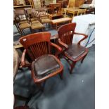 Pair of antique oak chairs with leather seats