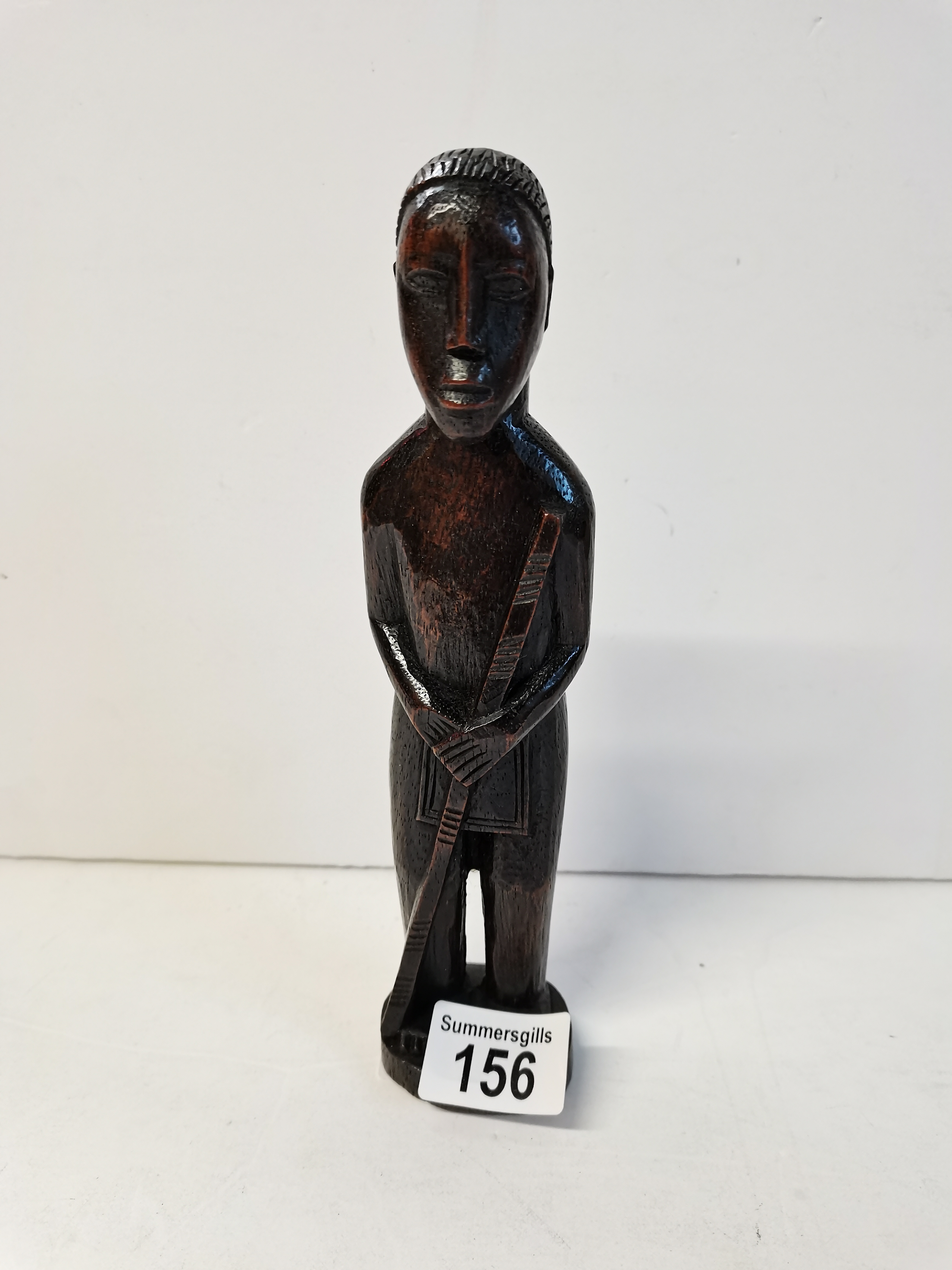 19th Century African carved hardwood figure of male chieftain with staff and loin cloth
