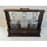 Set of 3 Crystal decanters in wooden holder (one has a broken neck)