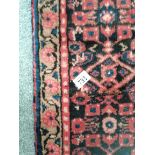 1.2 x 3.3m antique rug in red and blue colouring