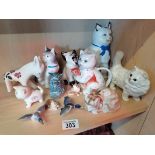 13 Pieces of Pottery 10 cats 2 ducks and a donkey Including 1 Beswick Cat (Damaged Ear to Donkey)