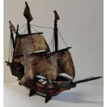 Wooden model of sailing ship on stand