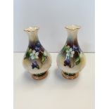 A pair of Royal Worcester vases, painted with violets No 285, green mark 11cm tall. (chip on