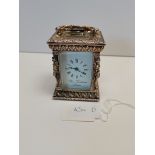 London Silver small clock (highly engraved)