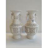 A pair of 20th Centaury Blance de Cine ajour lamp vases - excellent condition