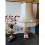 Floral Porcelain Lamp with Cream Shade "with signature on porcelain" and a brass and glass oil lamp