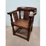 An early Mouseman monks chair 1926-27 for Brigadier Kenneth Hargreaves. Similar examples are known