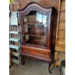 A mahogany display cabinet on stand