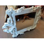 Ornate French style framed bevelled wall mirror