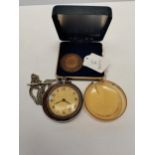 Pocket watch and medal