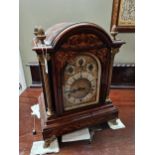 A large Edwardian bracket clock - chiming on eight and four gongs. In inlaid Rosewood case.